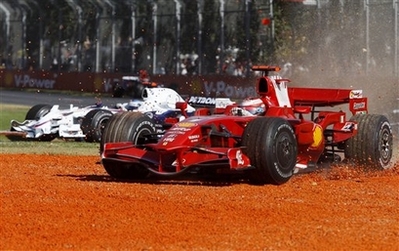 Ferrari Formula One driver Kimi Raikkonen of Finland, right, goes off the track into the kitty litter during the Australian Grand Prix at the Albert Park circuit in Melbourne, Australia, Sunday, March 16, 2008. (Source: AP) Ferrari Formula One driver Kimi Raikkonen of Finland, right, goes off the track into the kitty litter during the Australian Grand Prix at the Albert Park circuit in Melbourne, Australia, Sunday, March 16, 2008. (Source: AP)